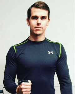 Jonas Lifeke standing with a gym shirt