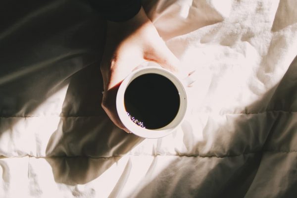 Coffe on a sleeping bed