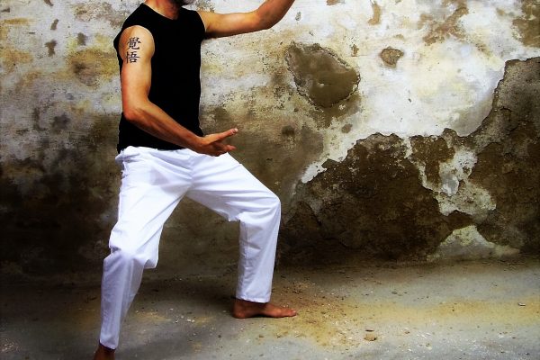 A man perfoming tai chi exercise